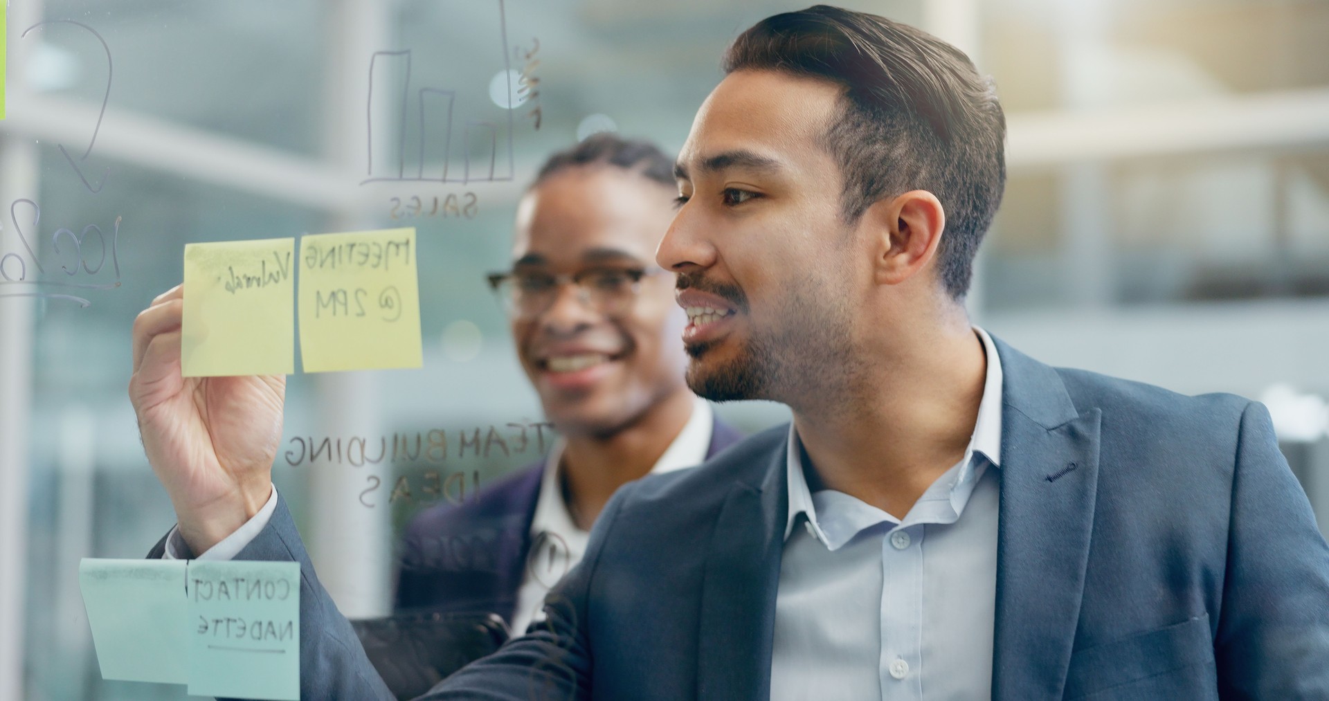 Glass, sticky note and business people with meeting in office for schedule, brainstorming and idea. Project management, men and employees with graph on board for sales planning, kpi growth and review